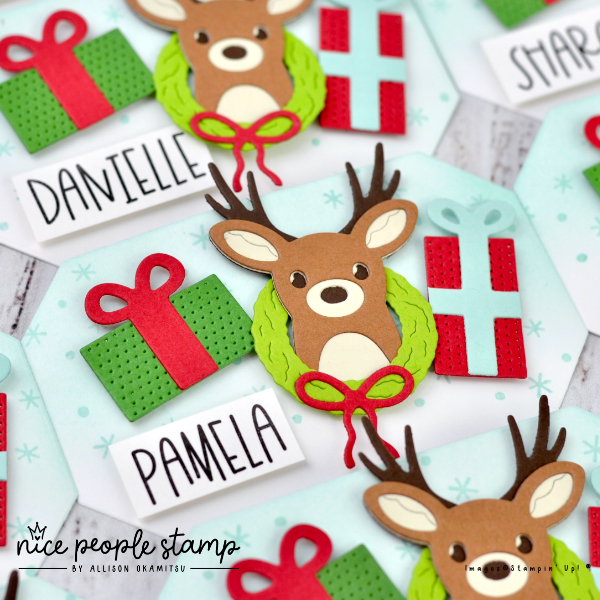 Name tag made with the Reindeer Fun Bundle from Stampin' Up! Each name tag features a die cut reindeer, two presents, and a wreath with a bow!